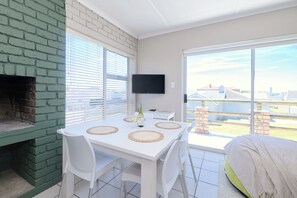 Design Apartment, 2 Bedrooms | Living area | TV, fireplace - Lands Edge Eco Friendly Cottages (Struisbaai)