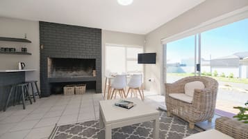 Deluxe Apartment | Living area | Fireplace
