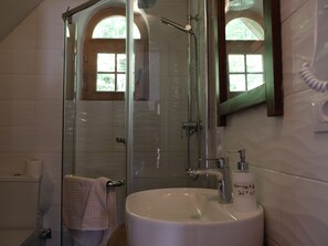 Shower, hair dryer, slippers, towels