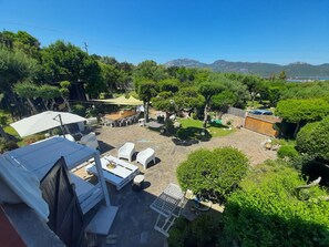 Terrace/patio - Comfortable studio apartment with large, lush garden with separate kitchenette. (Porto Rotondo)