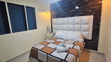 7 quartos, cofres nos quartos, ferros/tábuas de passar roupa