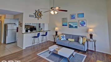 Condo, Multiple Beds, Balcony, Pool View (Gulfpoint 1302) | Living area | 32-inch TV with satellite channels