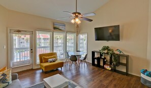 Condo, Multiple Beds, Balcony, Pool View (Gulfpoint 1302) | Living area | 32-inch TV with satellite channels