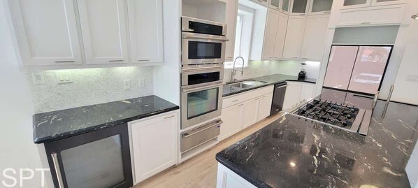 House, Multiple Beds, Pool Access (Padre Beach House) | Private kitchen | Fridge, oven, stovetop, dishwasher