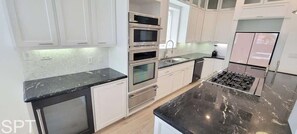 House, Multiple Beds, Pool Access (Padre Beach House) | Private kitchen | Fridge, oven, stovetop, dishwasher
