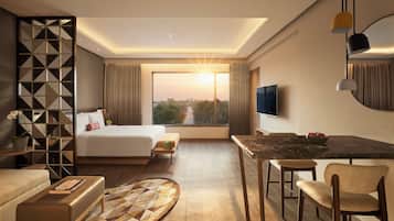 Premium Room, 1 King Bed, Pool View | Minibar, in-room safe, desk, laptop workspace