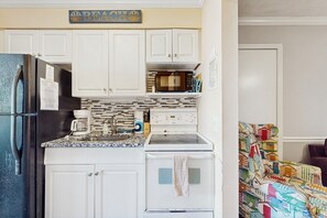 Fridge, microwave, oven, stovetop - Modern condo close to beach with pool, hot tub, & water view (Garden City Beach)