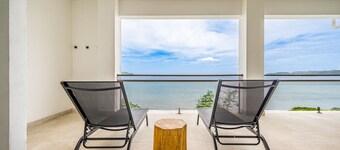 Spacious waterfront condo with shared pool, balcony, and washer/dryer