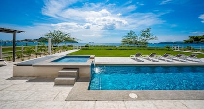 Spacious waterfront condo with shared pool, balcony, and washer/dryer