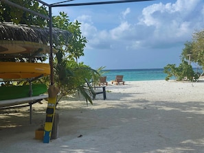Private beach, white sand, sun loungers, beach umbrellas