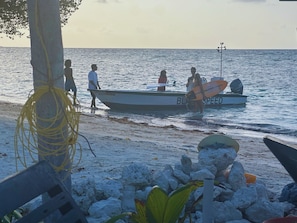Private beach, white sand, sun loungers, beach umbrellas