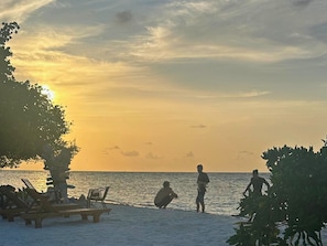 Private beach, white sand, sun loungers, beach umbrellas