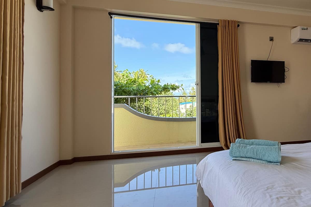 Family Room, 2 Bedrooms, Balcony, Sea View | Minibar, in-room safe, desk, laptop workspace