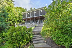A modern two-story house with a stone staircase leading to a covered porch. - Lakefront Lake Anna, Dock, Views, Deck, Movies (Mineral)