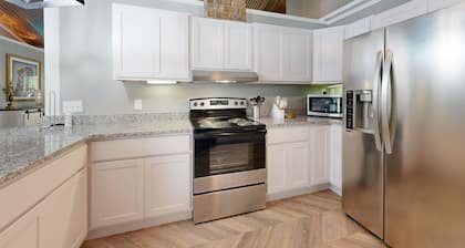 Modern home with full kitchen, patio and access to pond