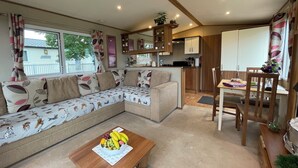 Living area - Paws a While! caravan with uninterrupted views of Solent and direct beach access (Great Thorness)
