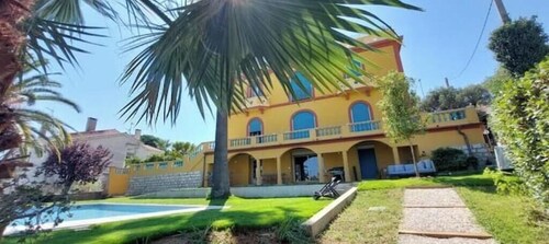 Large apartment in villa with garden and pool