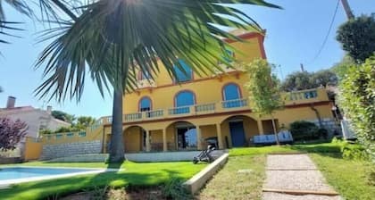 Large apartment in villa with garden and pool