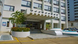 A modern building with a sign reading "CRISTOFORO COLOMBO".