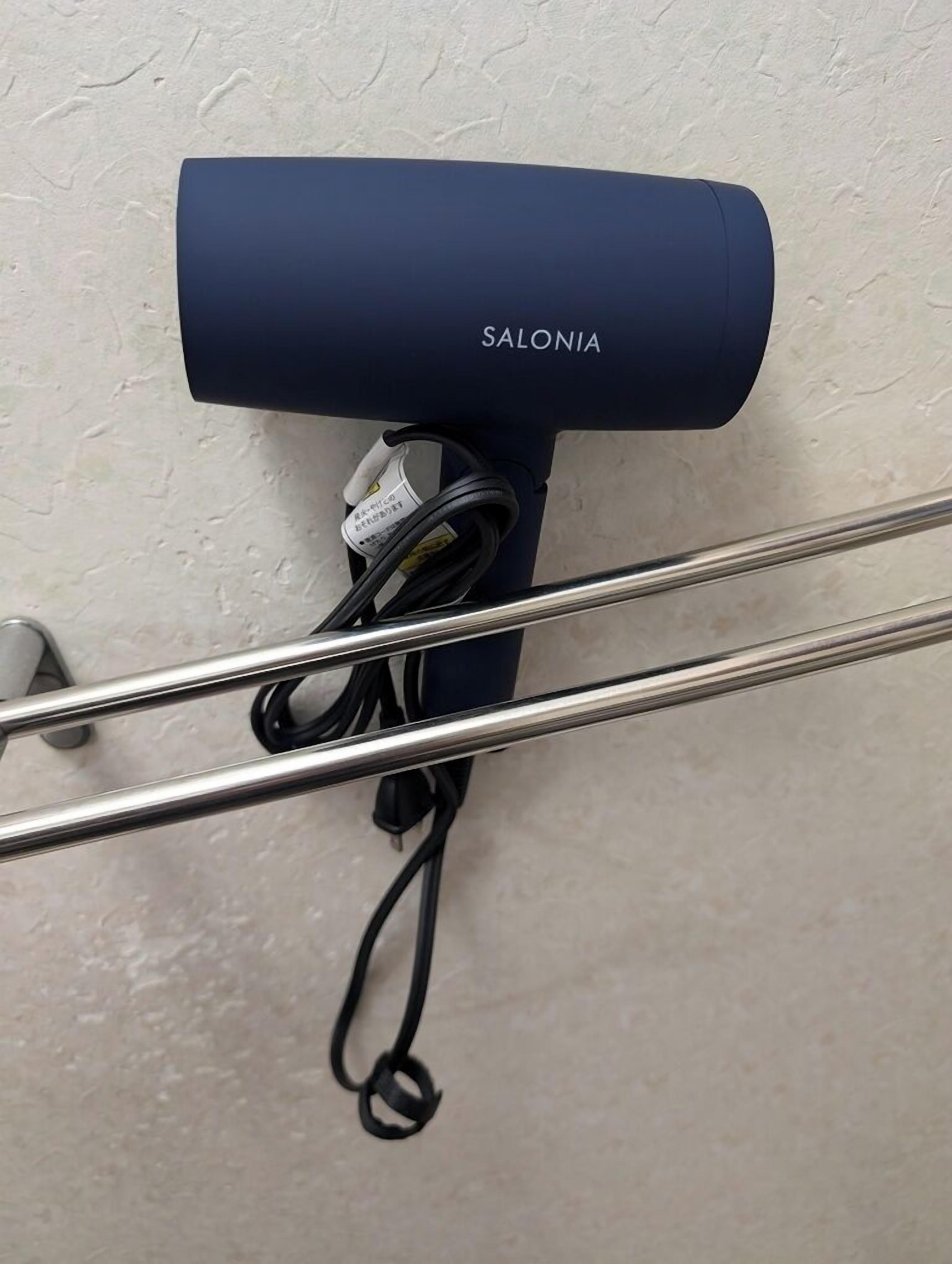 Combined shower/tub, hair dryer, slippers, soap