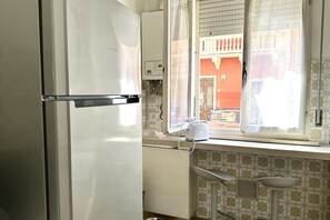 Fridge, oven, dishwasher, dining tables