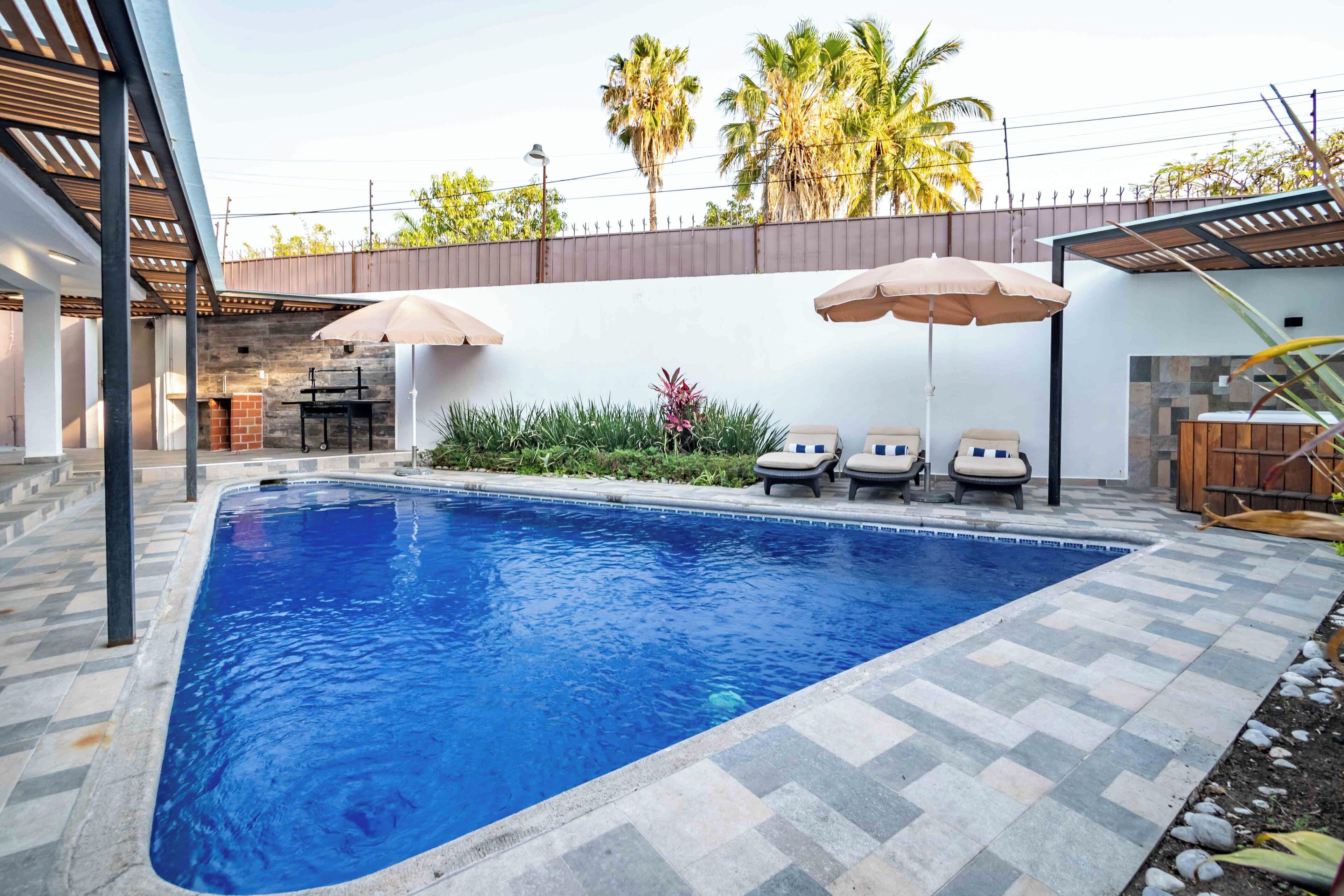 Outdoor pool, pool umbrellas, sun loungers