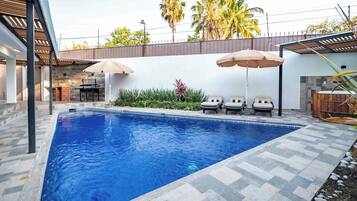 Outdoor pool, pool umbrellas, sun loungers