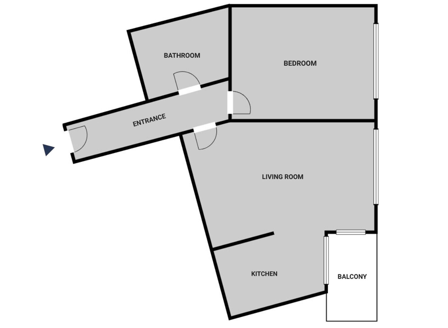 Plano de planta que muestra una sala de estar, cocina, balcón, dormitorio, baño y entrada.