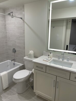 Shower, hair dryer, towels, soap - Experience the Charm of New Orleans CBD: Prime Location, Walkable, and Spacious (New Orleans)