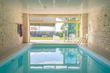 Pool. Petite house 'Gite Oléron Indoor Pool' with shared garden and Wi-Fi