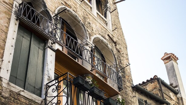 A historic building with ornate balconies and stone facade. - Sansoni Palace by Wonderful Italy (Venice)