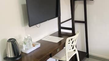 Minibar, desk, laptop workspace, iron/ironing board