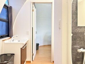 Hair dryer, electronic bidet, towels, soap