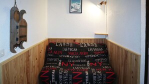A staircase with a black and red patterned carpet featuring city names. - Nice studio 6 persons COEUR DE STATION (LES ORRES 1650)