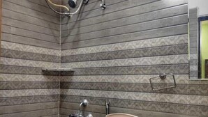 A bathroom with a toilet, sink, and shower. - PPH Living Royal GS Comforts Opp Mall of Asia (Bengaluru)