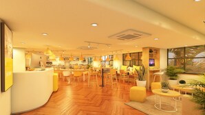 A spacious hotel lobby with wooden flooring, yellow pendant lighting, and a reception desk. - Bloom Hotel - Dona Paula (Panaji)