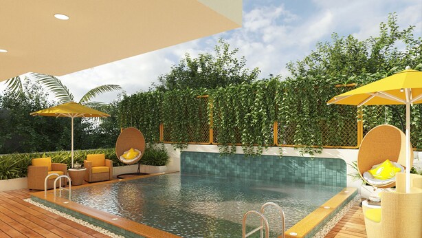 A swimming pool with a wooden deck, yellow chairs, and umbrellas. - Bloom Hotel - Dona Paula (Panaji)