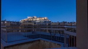 A view of the Acropolis in Athens from a high vantage point, including the Parthenon and surrounding buildings. - Unique 2BR Penthouse with Stunning Acropolis View (Athens)