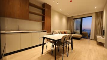 One-Bedroom Apartment with Balcony and Sea View | Living area | 32-inch flat-screen TV with cable channels