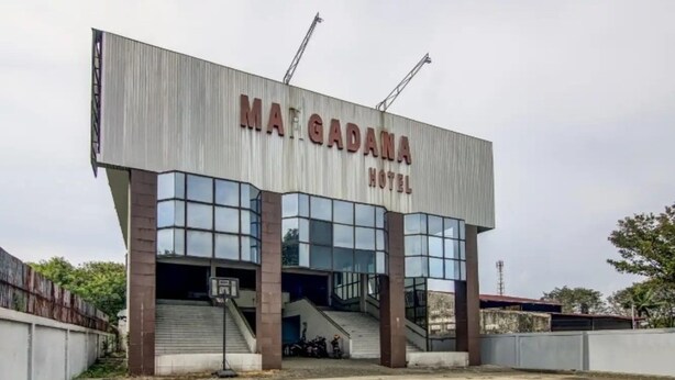 A modern building with a sign reading "Maf Gadana Hotel". - Hotel Margadana (Tegal)