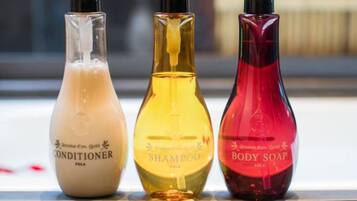 Three bottles of personal care products.