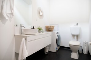 Shower, hair dryer, towels, shampoo