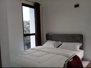 Deluxe Double Room | Free WiFi, bed sheets - Hotel O Mahagoni House Syariah (Bogor)