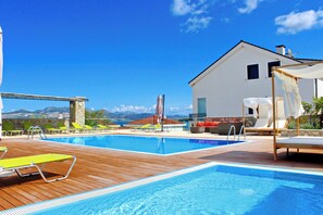 8 outdoor pools, pool umbrellas, sun loungers