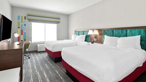 A hotel room with two beds, a desk, a chair, a TV, and a window with blinds. - Hampton Inn & Suites Sherman (Sherman)