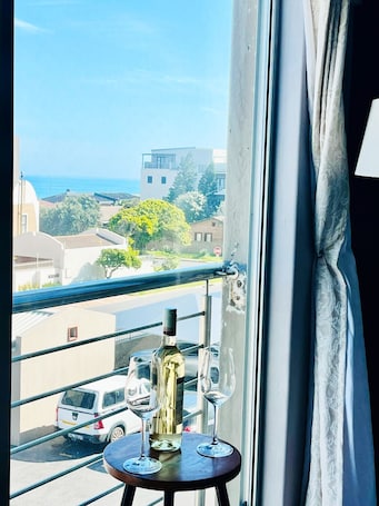 Family Apartment, Partial Ocean View | Living area | TV