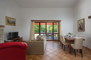 Family House, Multiple Bedrooms, 2 Bathrooms (Pool House In Greenery) | Living area | 21-inch flat-screen TV with satellite channels, fireplace
