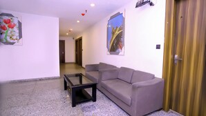 Standard Double Room, City View | Living area | 32-inch LED TV with cable channels - Hotel Core One Bliss  (Noida)