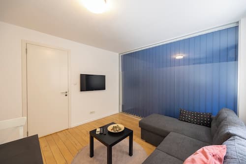 Family Apartment | Living area | 32-inch LCD TV with cable channels, Netflix, streaming services