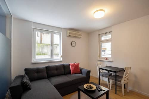 Family Apartment | Living area | 32-inch LCD TV with cable channels, Netflix, streaming services